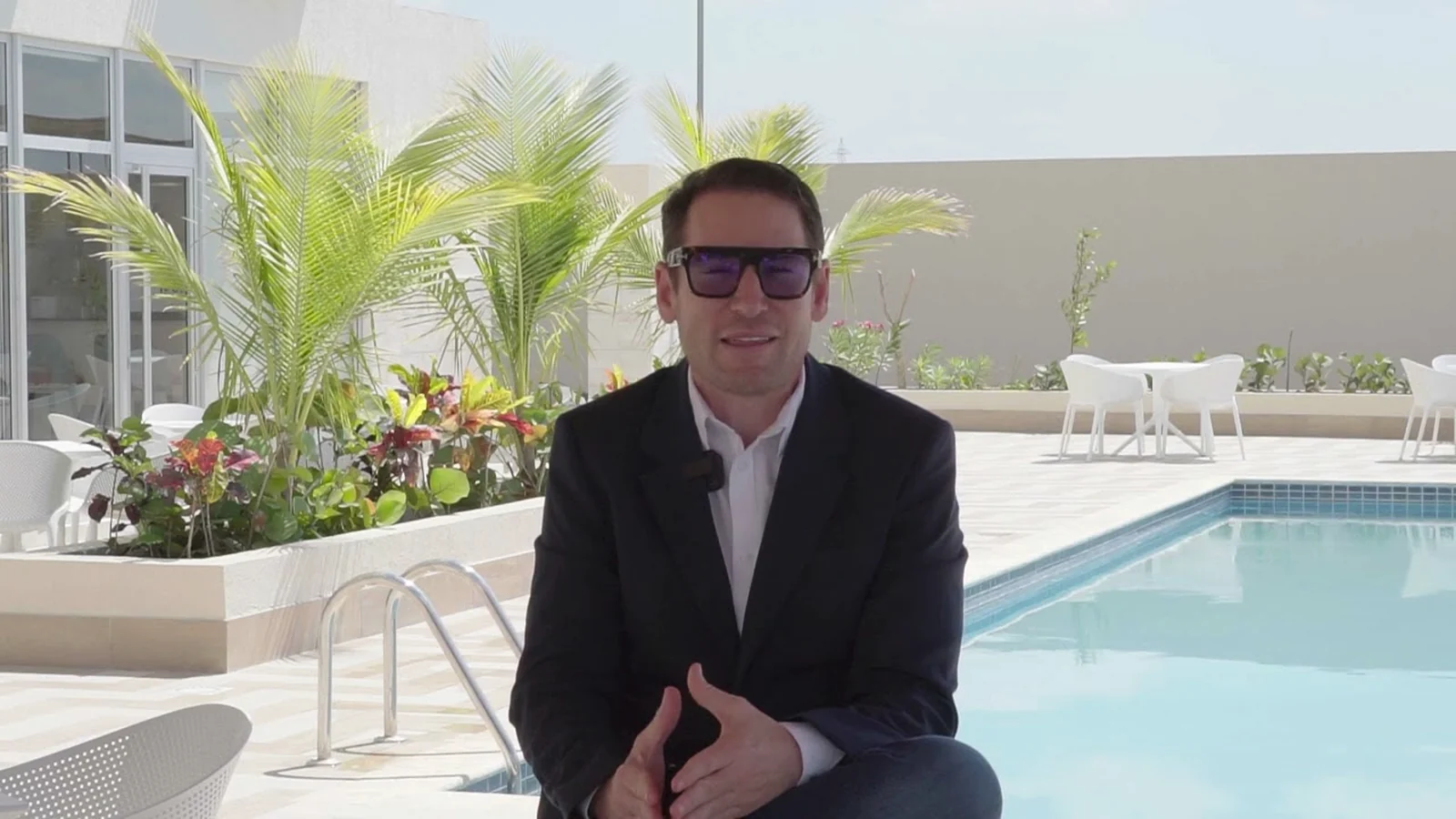Edward De Valle II filmed beside a hotel pool in the Dominican Republic