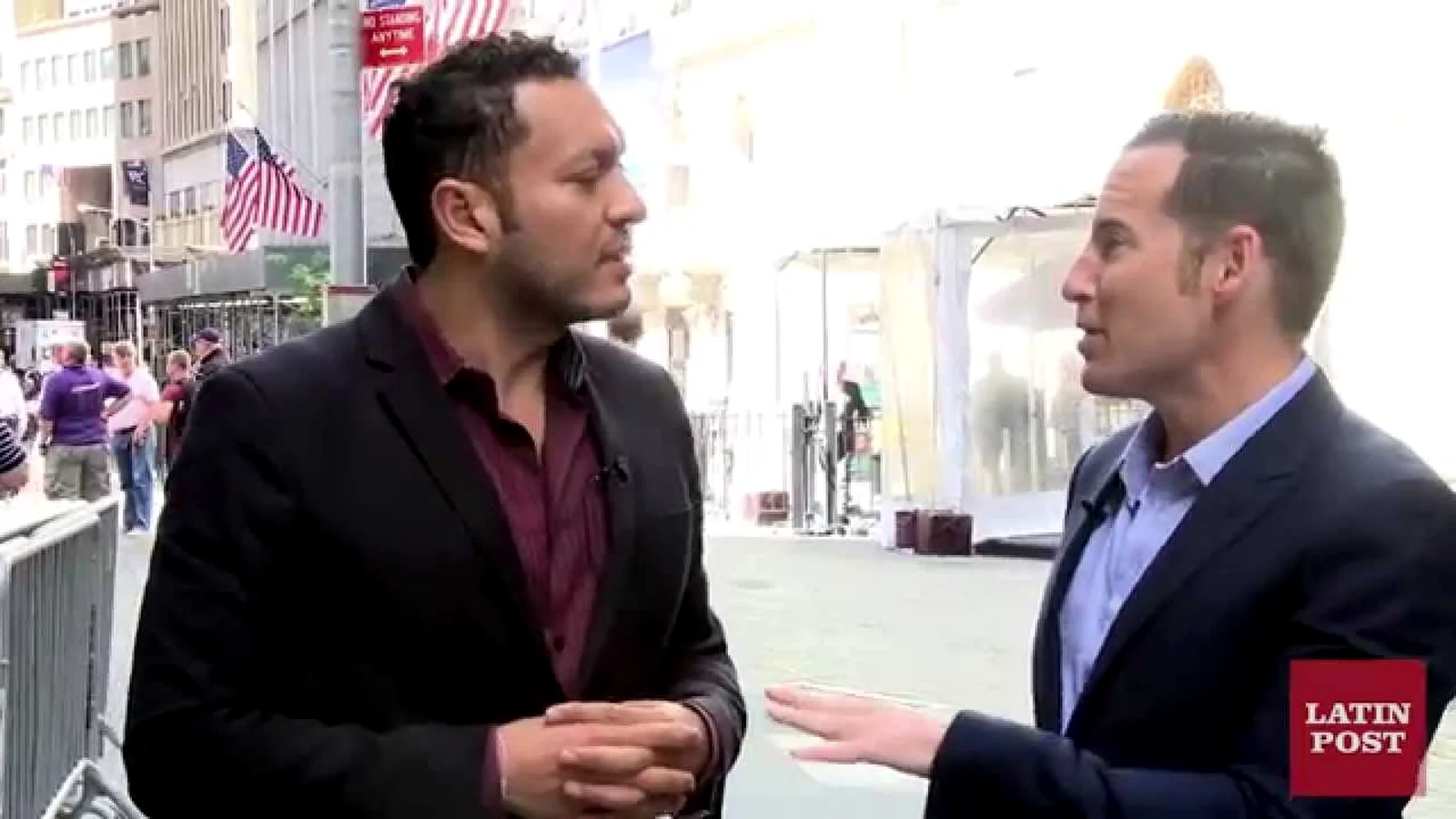 Edward De Valle II being interviewed on the street on Wall Street, New York