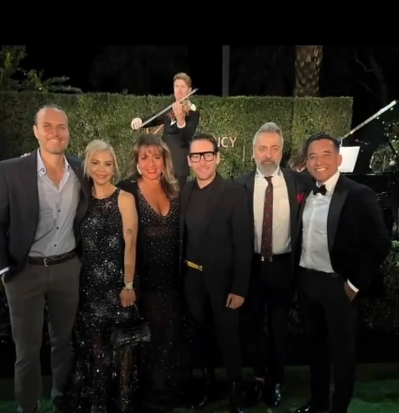 Edward De Valle II with The Agency partners at a company event
